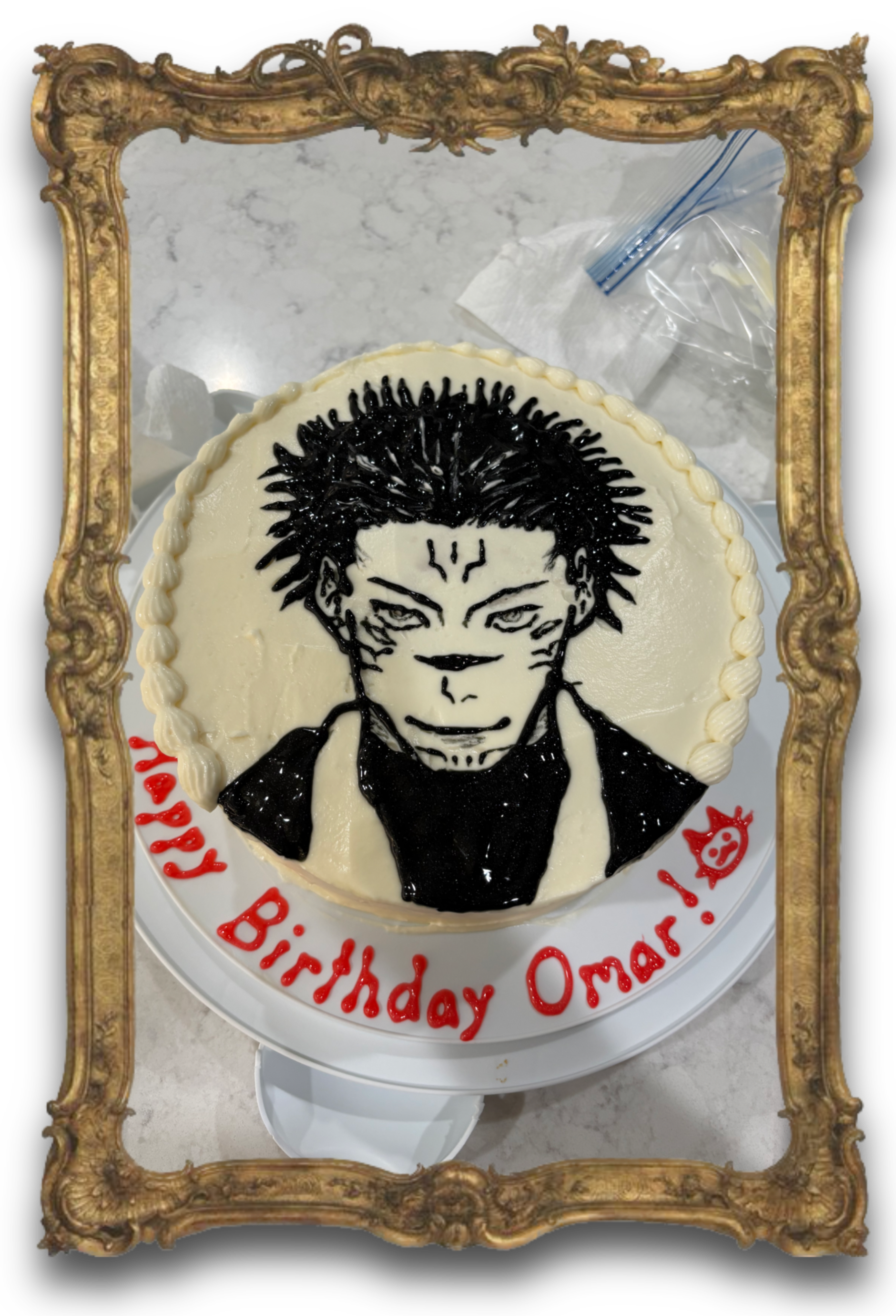 A well-decorated cake with a rendition of Sukuna on top.